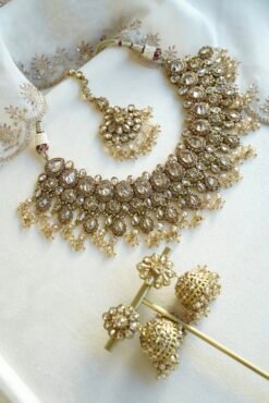 Seyora Jewels Tanya necklace set featuring champagne stones and hanging champagne crystal beads with matching jhumka earrings and maang tikka.