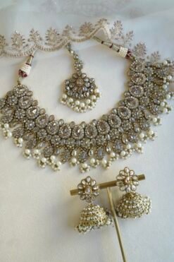 Seyora Jewels Tanya necklace set featuring champagne stones and delicately hanging pearl beads with matching jhumka earrings and maang tikka.