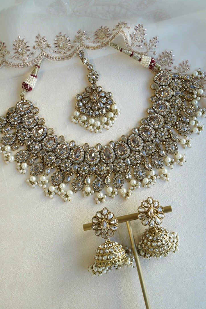 Seyora Jewels Tanya necklace set featuring champagne stones and delicately hanging pearl beads with matching jhumka earrings and maang tikka.